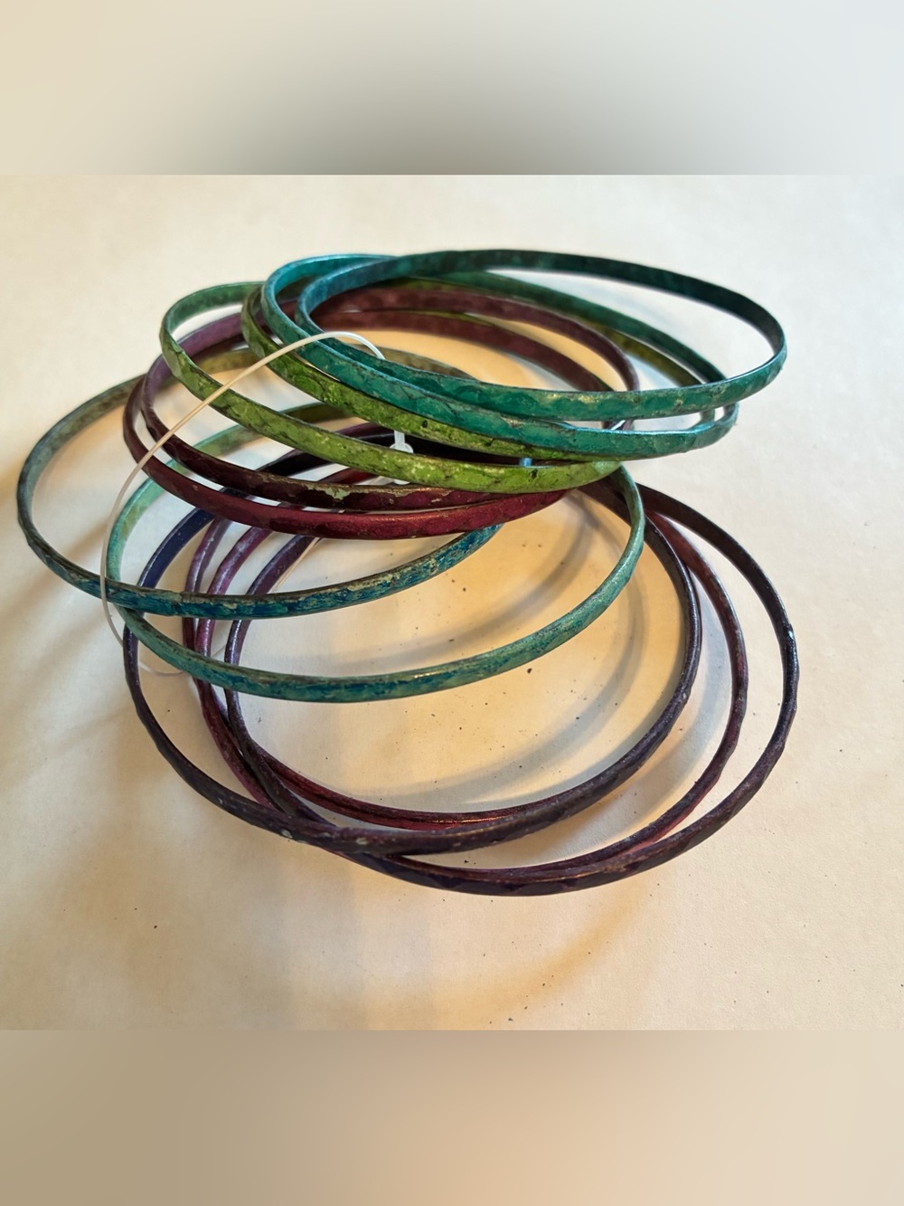 Vibrant Stack of 12 Thin Jewel-Toned Metal Bangle Bracelets – Hammered Texture